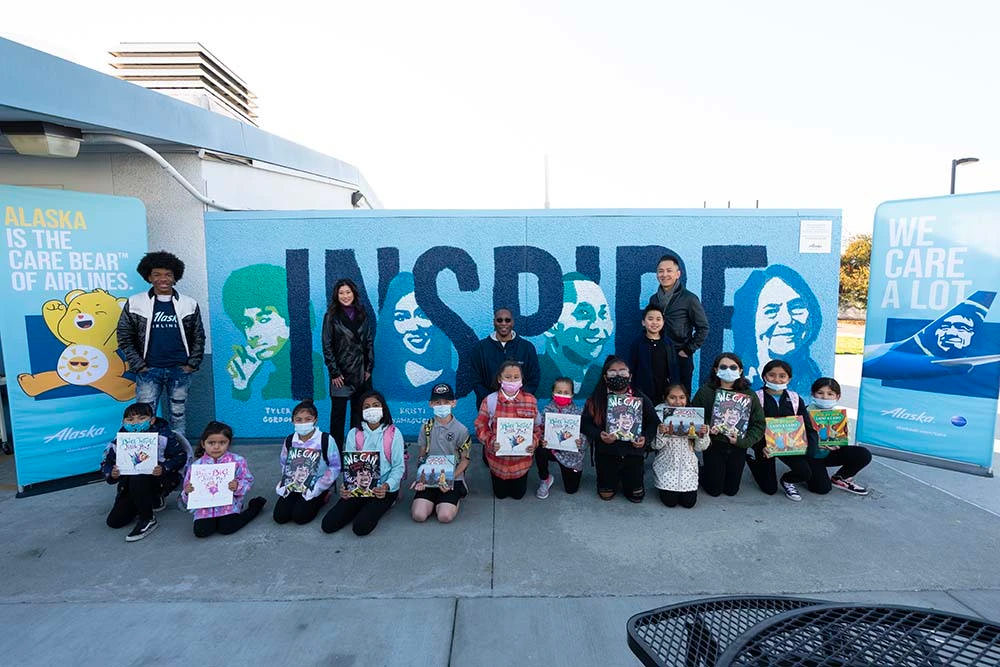 Yamaguchi, Gordon and Nguyen joined Alaska Airlines employees to unveil the mural